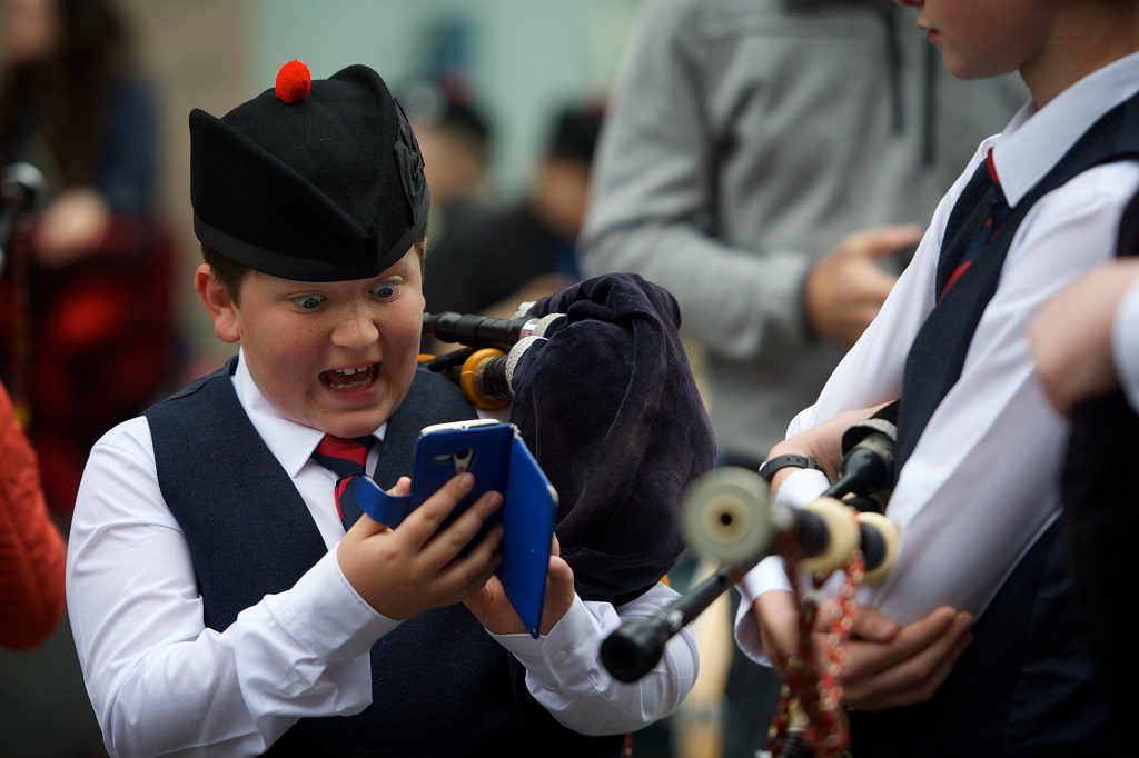 Paisley Piper catches a Pokomon. Ruari Buchan a young piper withe the Johnstone Pipe Band got lucky in Paisley just before performing for the judges at the Paisley Pipe Band Championship. While the others were getting their pipes tuned Ruari had a quick check and bagged himself a Pokomon. Pic by Kieran Chambers