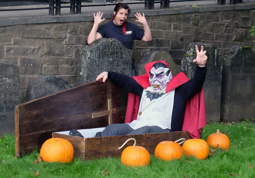 Graveyard tour guide Emma Armstrong gets a fright as she stumbles on Dracula and his coffin in the ground of Paisley Arts Centre