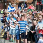 Crowds gather in Renfrew to welcome the baton