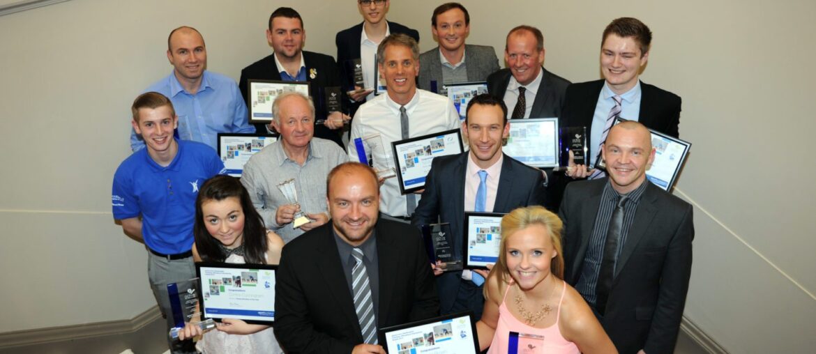 Cllr Stuart Clark, Depute Convener of Sport, Leisure and Culture Board, with award winners in Paisley Town Hall