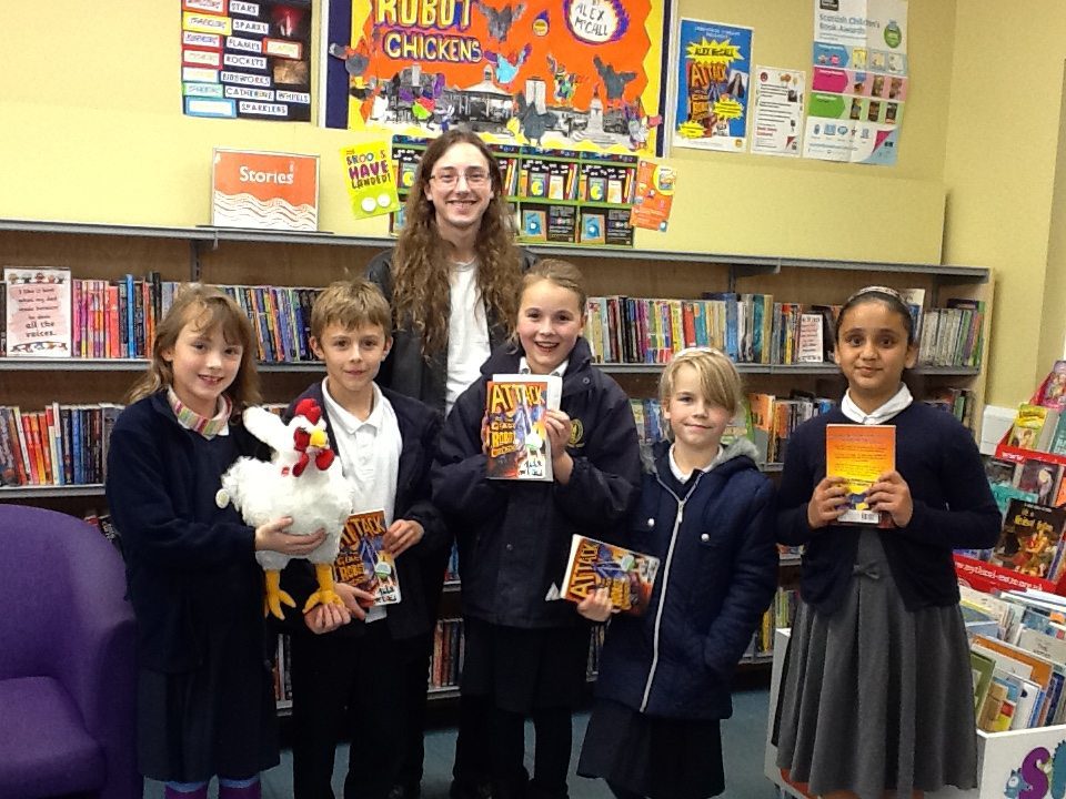Children's Author Alex McCall and Johnstone Library Book Group with his book Attack of the Giant Robot Chickens