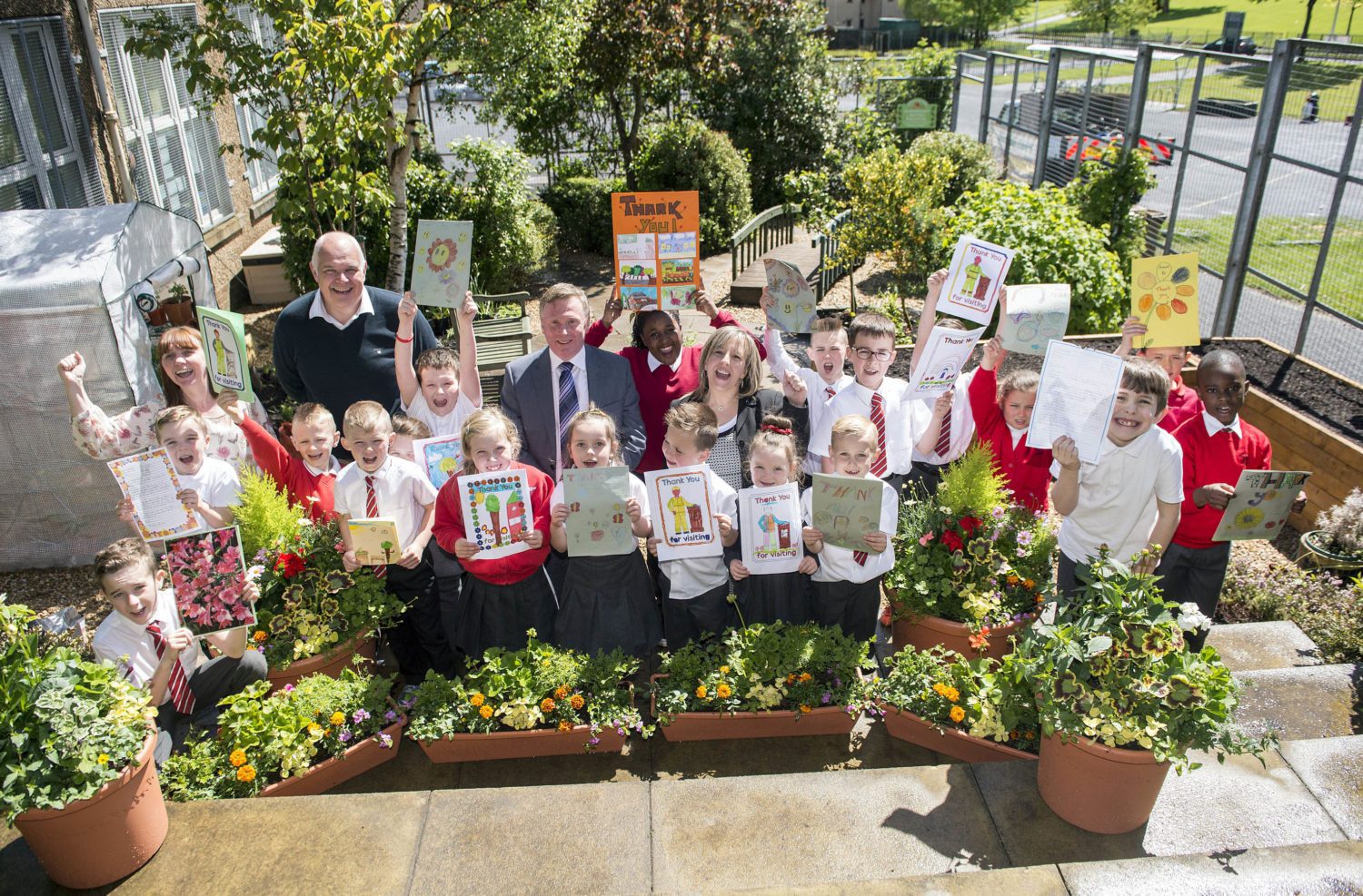 Captions Garden 1 pic: General manager at intu Braehead, Gary Turnbull with Caragh Moohan, aged five and six-year-old Kodey McDonald. Garden 2 pic: Pupils Caragh Moohan, aged five; Lucy McLay, aged nine and six-year-old Kodey McDonald enjoy their refurbished garden after it was vandalised. Thanks pic: Pupils at St Paul’s Primary made ‘thank you’ cards for intu Braehead general manager, Gary Turnbull, second from left in back row and Drew Gallagher, a director with Cardwell Nurseries, left.