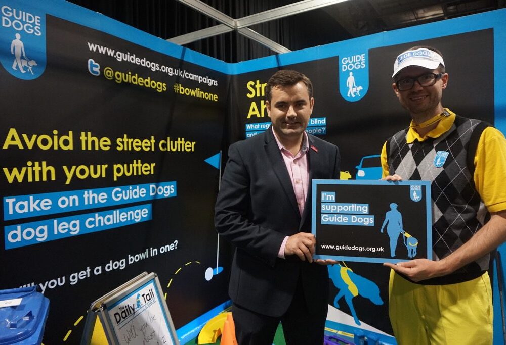 Gavin Newlands MP gets a “dog bowl in one” for Guide Dogs Scotland