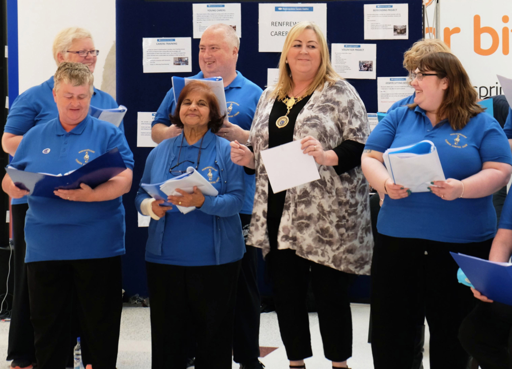 Provost joins in with Carers Centre choir to give shoppers a song