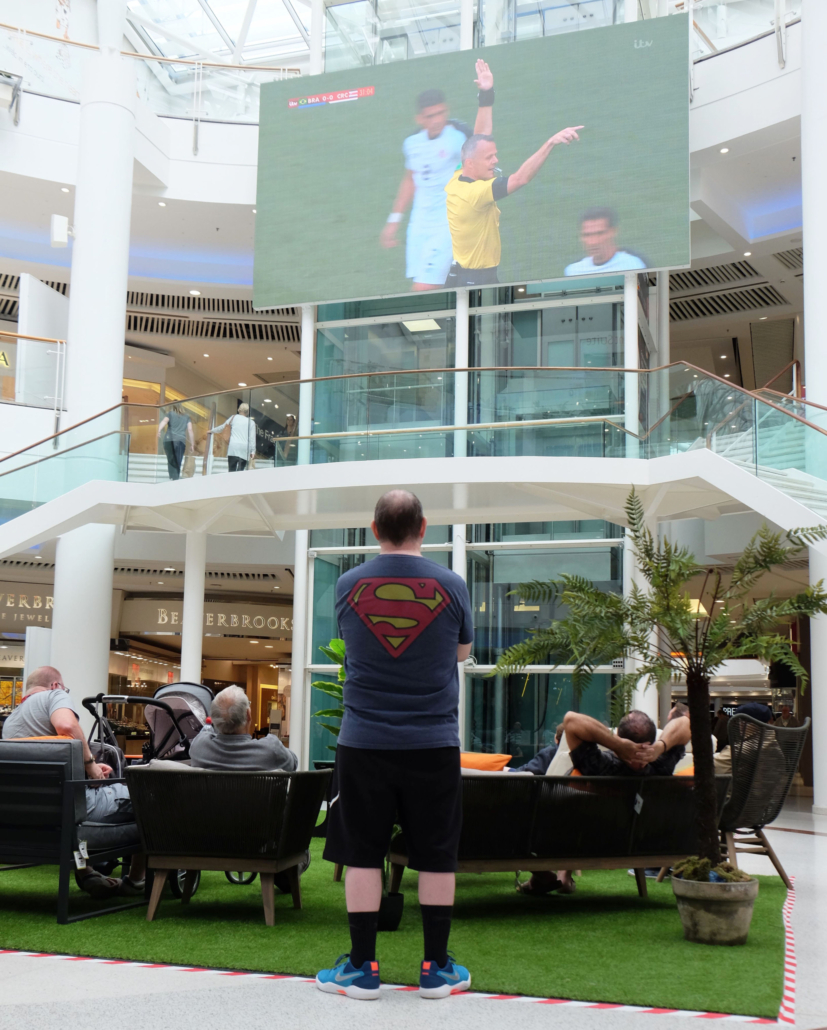 Shoppers have a ball watching World Cup on mall’s giant screen