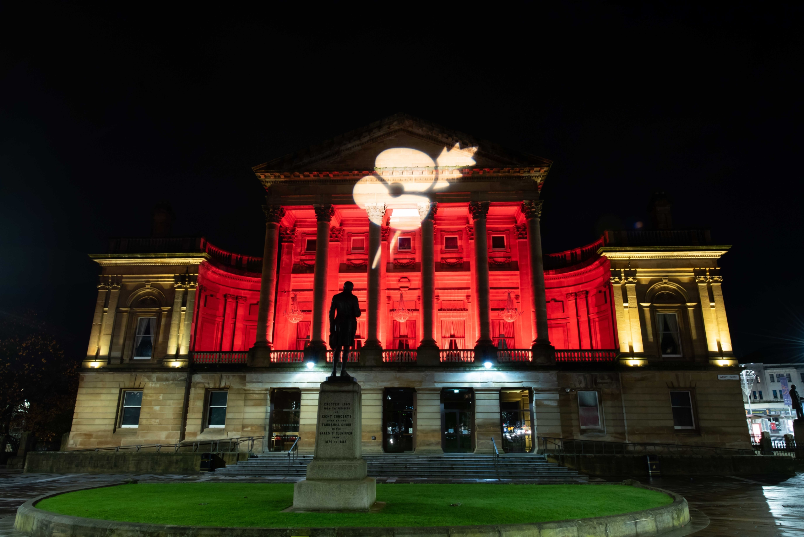 Paisley Town Hall lit up in red
