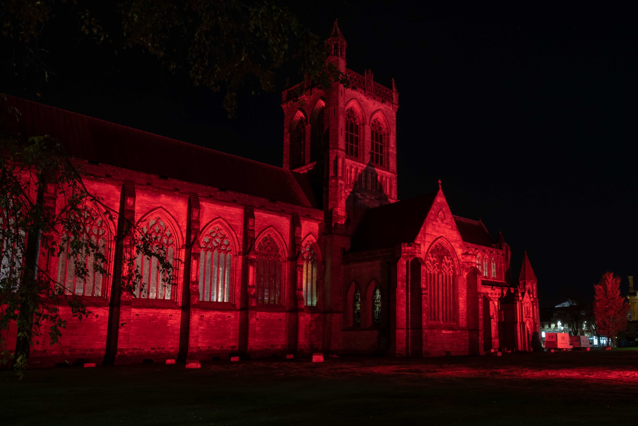 Pasiley Abbey lit up in red