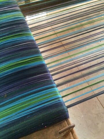 Fair trade tartan threads on loom