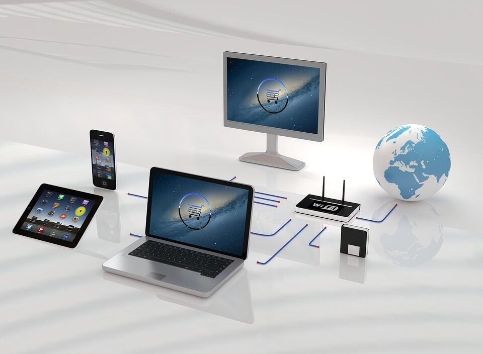 Digital devices around a central globe icon, including a laptop, tablet, smartphone, monitors, a router, and a floppy disk, symbolize global connectivity and communication technology.