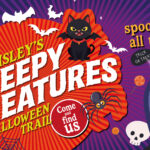 Bright, spooky Halloween poster with bats, a black cat, spider, crow, skull, and webs. Large text reads "Paisley's Creepy Creatures Halloween Trail." Event runs October 10th to November 2nd. "Spooky fun for all the family.